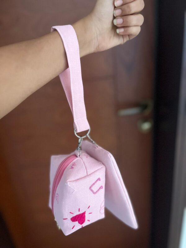 Hand embroidered jute wristlet